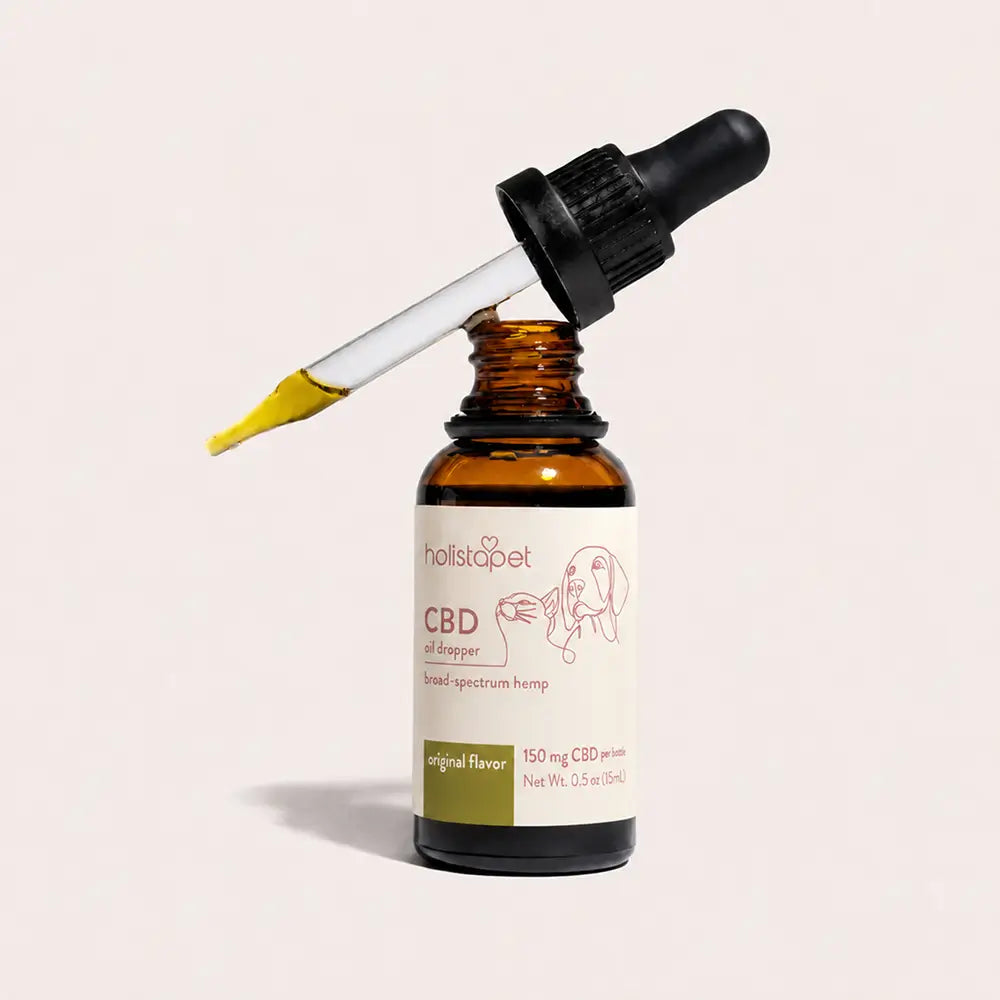 150mg pet cbd oil dropper bottle, white background, with some yellow-ish cbd oil in the dropper slanted off the top-cap